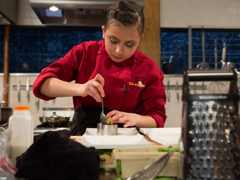 Teen Chopped champion 16 year old Yazmene Kaylani works on her appetizer that must include:tuna in oil, sugar snap peas, fruit candy squares and gnocchi for Chopped Teen Week $25,000 tournament, as seen on Food Network's Chopped, Season 25.