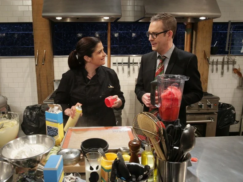 Ted Allen and Alex Guarnaschelli during a Halloween theme webisode with special ingredients, day of the dead cookies, boo-nilla shake, chocolate covered bugs and watermelon brain, as seen on Food Networkâ  s Chopped After Hours, Season 26.