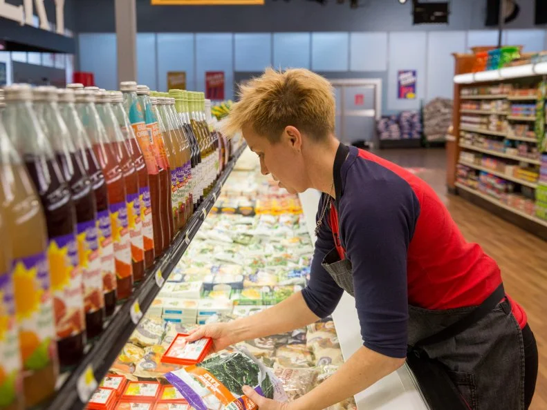 Celebrity Chef Elizabeth Falkner searches for ingredients during shopping for Game 1, Frozen Food Can Can, as seen on Food Network's Guy's Grocery Games, Season 7.