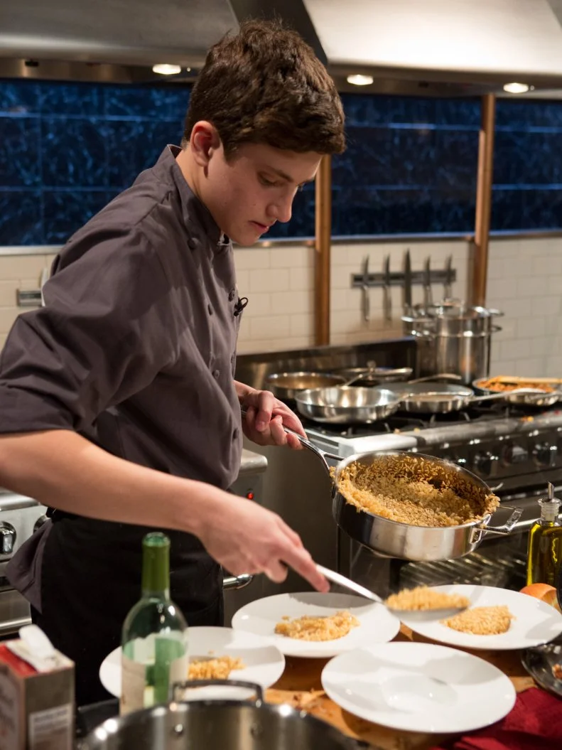 15 year old Danny Ganzman works on his appetizer that must include: spicy Italian sausage, white asparagus, habanero peppers and soup dumplings for Chopped Teen Week $25,000 tournament, as seen on Food Network's Chopped, Season 25.