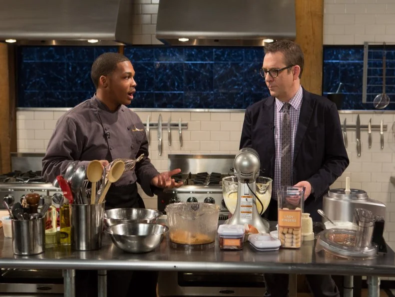 Chopped host Ted Allen checks in on 16 year old Justin Ballenger as he works on his dessert that must include: flame grapes, peanut and caramel candy bar, greek yogurt and mango nectar for Chopped Teen Week $25,000 tournament, as seen on Food Network's Chopped, Season 25.