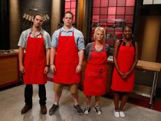 The red team recruits pose together before elimination on the set of Food Network's Worst Cooks in America, Season 8.