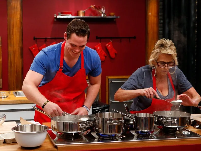Red team recruits Taylor Hoopers and Donna Koen prepares eggs during a skill drill challenge as seen on Food Network's Worst Cooks in America, Season 8.