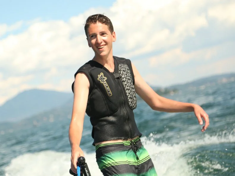CU shot of Hunter Fieri wake boarding on Lake Maggiore in Stresa, Italy as seen on Food Network's Guy's European Vacation episode 2.