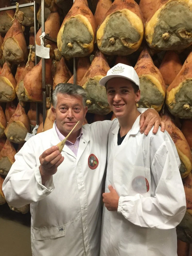 Portrait shot of Hunter Fieri and the prosciutto maker at La Perla Prosciutteria in Parma, Italy as seen on Food Network's Guy's European Vacation episode 3.