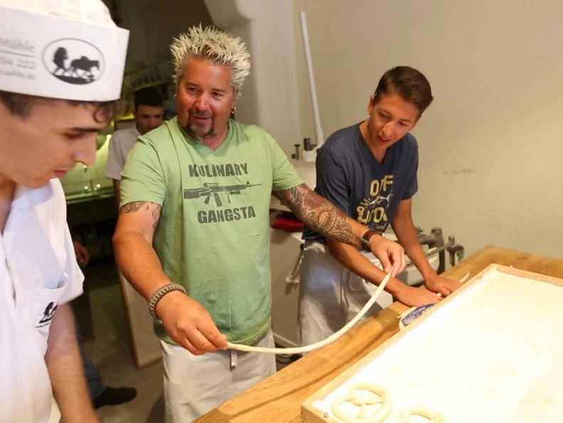 Guy and Hunter in Munich, Germany making pretzels at the Hofbrauhaus Kunstmuhle as seen on Food Network's Guy's European Vacation episode 4.