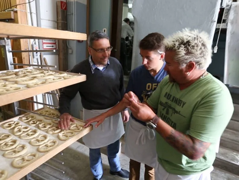 Guy and Hunter in Munich, Germany at Hofbrauhaus Kunstmuhle pretzel shop as seen on Food Network's Guy's European Vacation episode 4.
