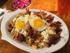 <p>Head to this hip tavern for your fry fix. Michael Symon favors the Gravy Frites, which are cooked in duck fat and then smothered with mozzarella cheese and brown gravy. The Animal Style Frites are also a must-try: These fries come heaped with cheese curds, pork belly lardons and sunny-side-up eggs.</p>