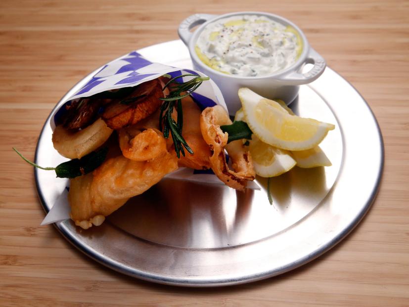 Host Tyler Florence's Fish and Chips dish is displayed on the set of Food Network's Worst Cooks in America, Season 8.