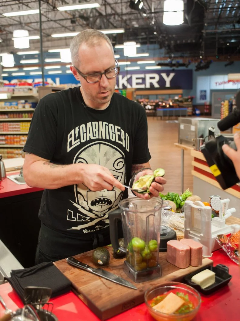 Contestant Eric WIlliams cooks, as seen on Food Network's Guy’s Grocery Games, Season 8.