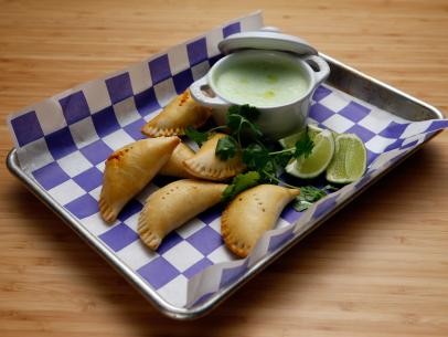 Host Tyler Florence's Cuban Picadillo Empanada with Cilantro Crema dish is displayed on the set of Food Network's Worst Cooks in America, Season 8.