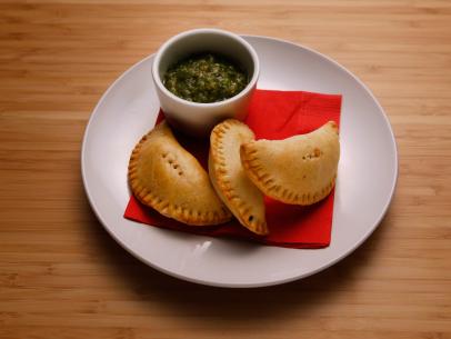 Host Anne Burrell's Pork and Potato Empanada with Charred Tomatillo Sauce dish is displayed on the set of Food Network's Worst Cooks in America, Season 8.