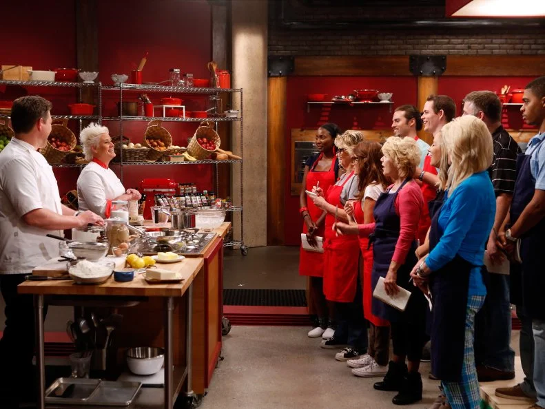 Co-Hosts Tyler Florence and Anne Burrell demonstrate to the recruits how to make ice cream and cookies from scratch for their ice cream sandwich challenge as seen on Food Network's Worst Cooks in America, Season 8.