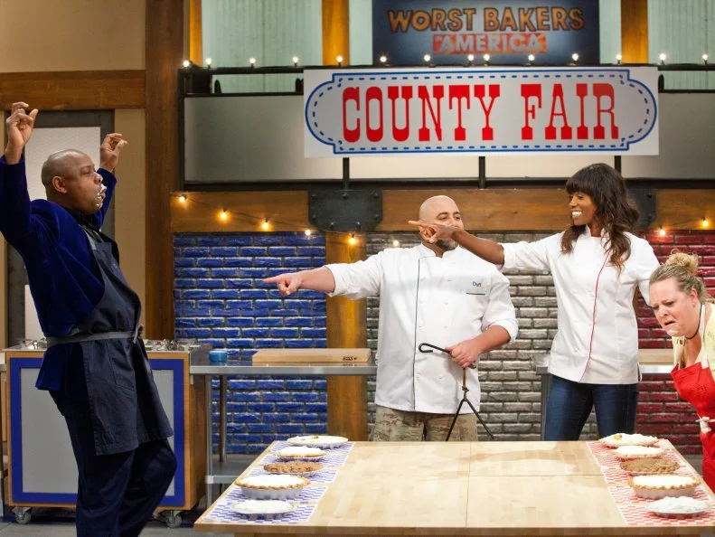 Contestant Carey Westbrook the first round of the pie eating contest. The contestants compete with each other to see who can guess the correct ingredients first, as seen on Food Network's Worst Bakers In America, Season 1.