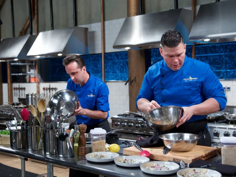 Chefs Bradley Stellings (L) and Demetrio Zavala during the appetizer round, as seen on Food Network's Chopped, Season 31.