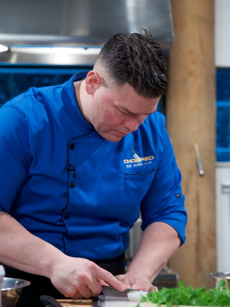 Chef Demetrio Zavala cooks Lutkisk crudo with chipotle jalape–o skordalia and mache salad during the appetizer round, as seen on Food Network's Chopped, Season 31.