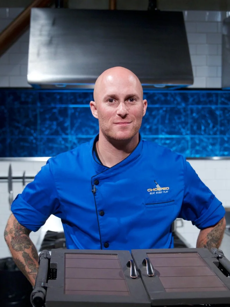Chef Jay Abrams poses on set, as seen on Food Network's Chopped, Season 31.