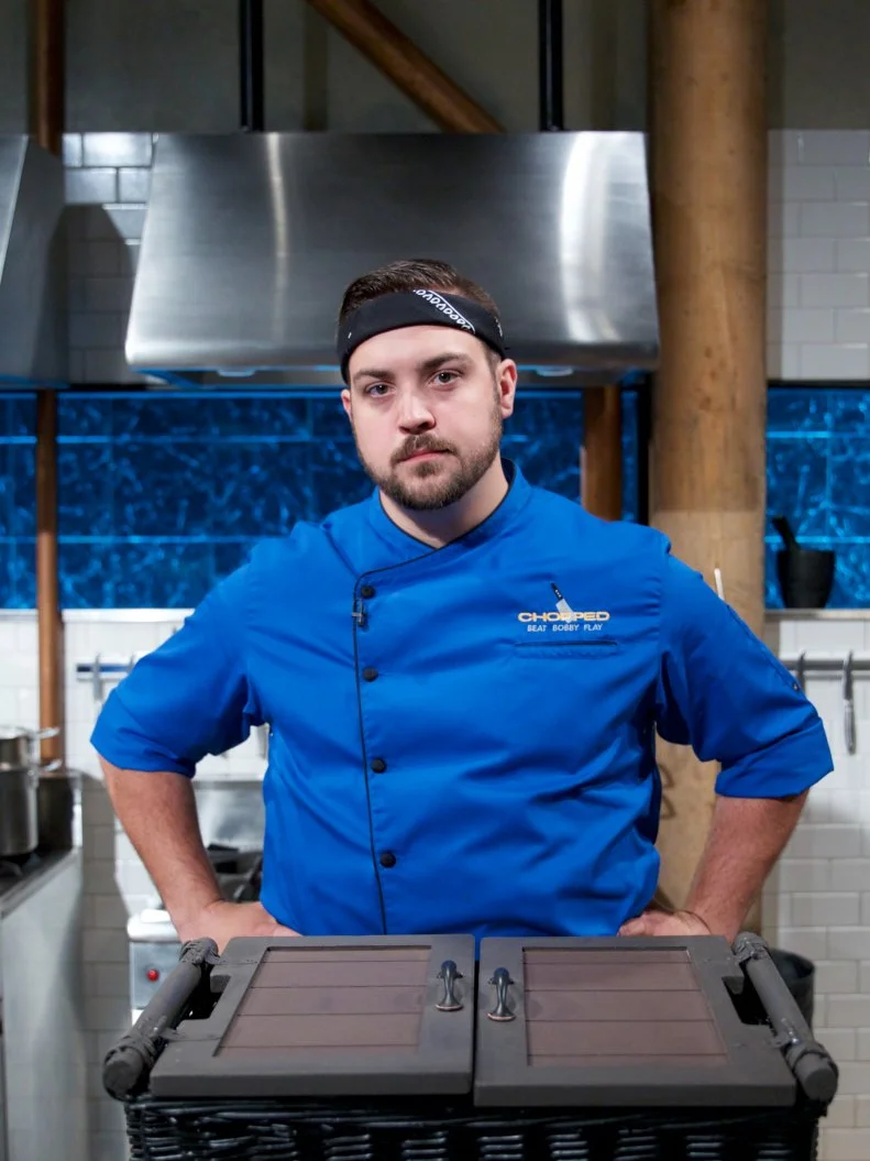 Chef Mike Romine poses on set, as seen on Food Network's Chopped, Season 31.