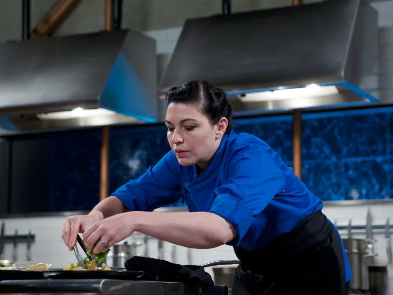 Chef Mackenzie Hilton cooks SautŽed Lutfisk with white wine pancetta and crunchy berry crust served with crispy wonton mache salad and a fire roasted red pepper skordalia spread during the appetizer round, as seen on Food Network's Chopped, Season 31.