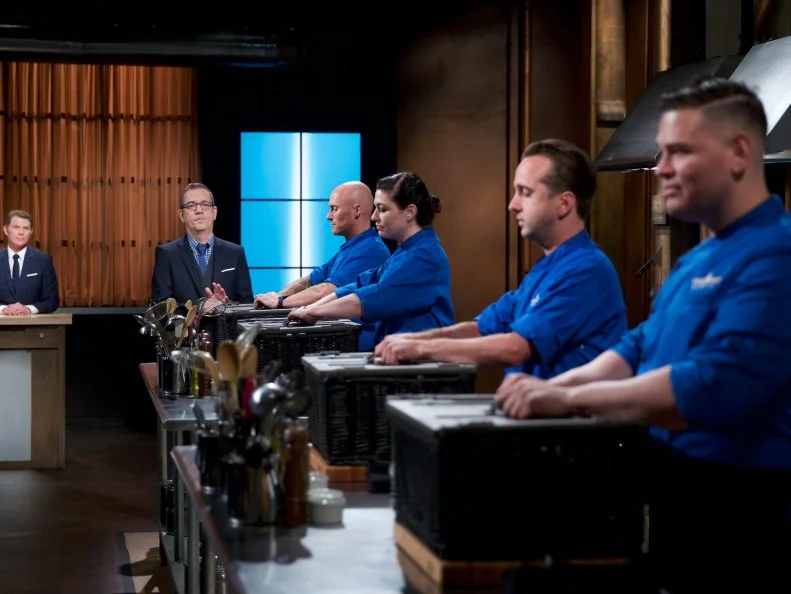 Judge Bobby Flay (L) with Host Ted Allen and chefs Jay Abrams, Mackenzie Hilton, Bradley Stellings, and Demetrio Zavala, as seen on Food Network's Chopped, Season 31.
