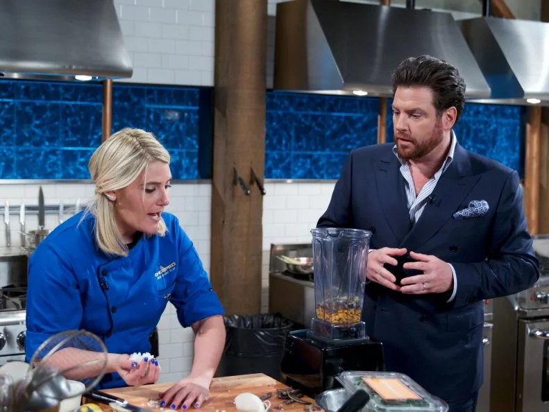 Chef Heather Borden (L) with judge Scott Conant during the entrŽe round, as seen on Food Network's Chopped, Season 31.