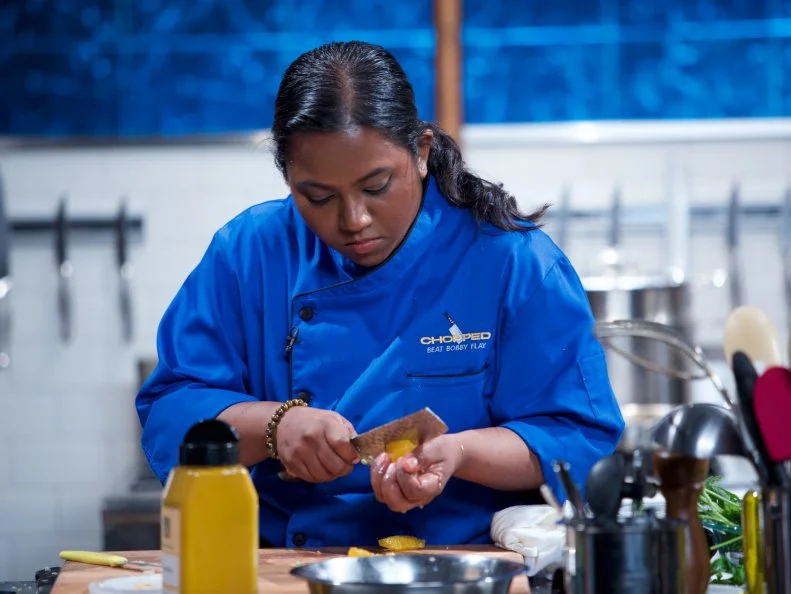 Chef Aarthi Sampath cooks Lobster gazpacho masala with turmeric zucchini and kale orange mint salad during the appetizer round, as seen on Food Network's Chopped, Season 31.
