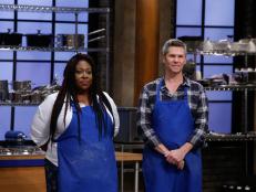 Loni Love and John Henson of the blue team appear, as seen on Food Network's Worst Cooks in America, Season 9.