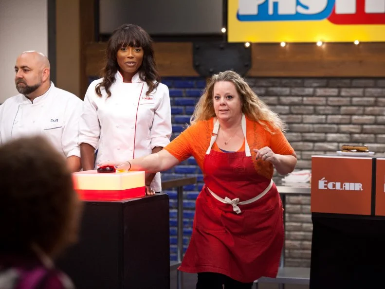 Contestant Stephanie Garcia plays a new game called "Name That Pastry" where contestants will receive a variety of pastries that they will have to properly name. The team that names them the quickest wins. Each team will have to take a tray of pastry and place it on the propper box with the correct name of that pastry.  As seen on Food Network's Worst Bakers In America, Season 1.