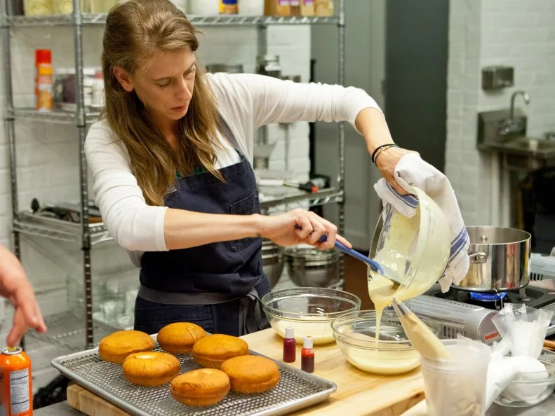 Finalist Samantha Brown works oh her glaze that she will use to cover her donuts with. As seen on Food Network's Worst Bakers In America, Season 1.