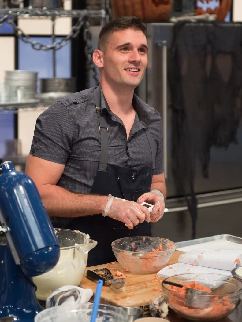 Competitor Ryan Neiman races to finish his Cake Pop's dish, as seen on Food Network’s Worst Bakers In America, Season 1.