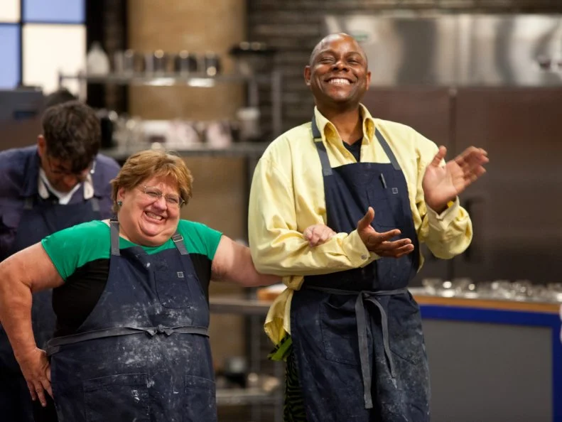 Contestants Judy Welch and Carey Westbrook wait to hear from the judges who will be eliminated and going home.  As seen on Food Network's Worst Bakers In America, Season 1.