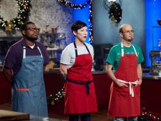 Contestants Shawne Bryan, Cheryl Storms and Jason Smith in evaluations for the Main Heat, Santa's Workshop Cakes, as seen on Holiday Baking Championship, Season 3.