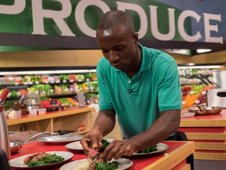 Contestant Andy Hyde plates his dish, as seen on Food Network's Guy's Grocery Games, Season 11.
