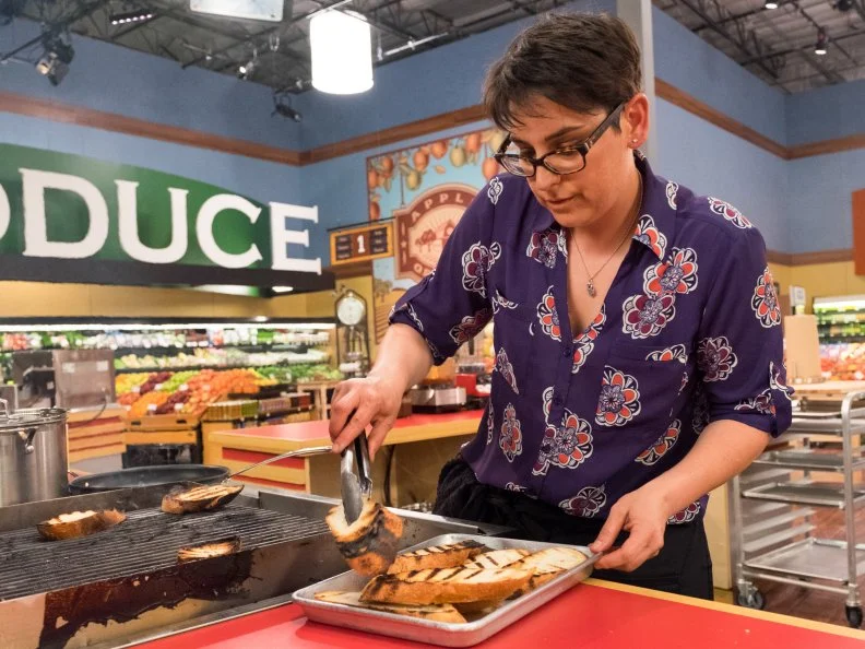 Contestant Nelle Bauer prepared her dish, as seen on Food Network's Guy's Grocery Games, Season 11.