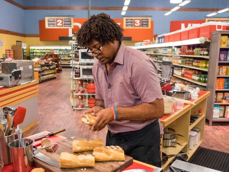 Contestant Stephen Jones prepares his dish, as seen on Food Network's Guy's Grocery Games, Season 11.