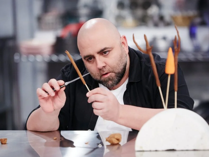 Host Duff Goldman preparing his dish, Snowman, as seen on Food Network's Holiday Baking Championship: Duff's Sweet Spot, Season 3.