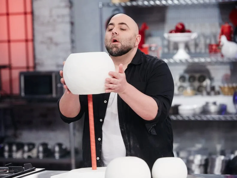 Host Duff Goldman preparing his dish, Snowman, as seen on Food Network's Holiday Baking Championship: Duff's Sweet Spot, Season 3.