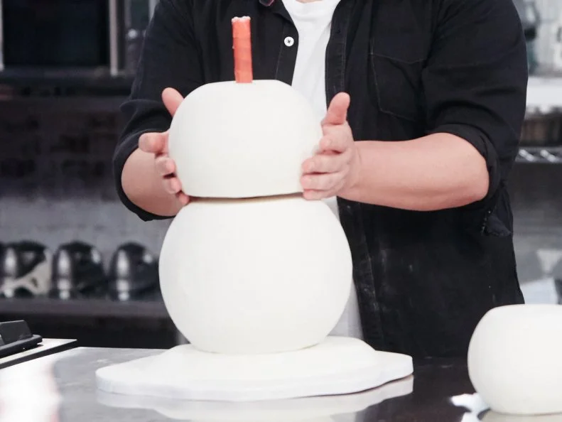 Host Duff Goldman preparing his dish, Snowman, as seen on Food Network's Holiday Baking Championship: Duff's Sweet Spot, Season 3.