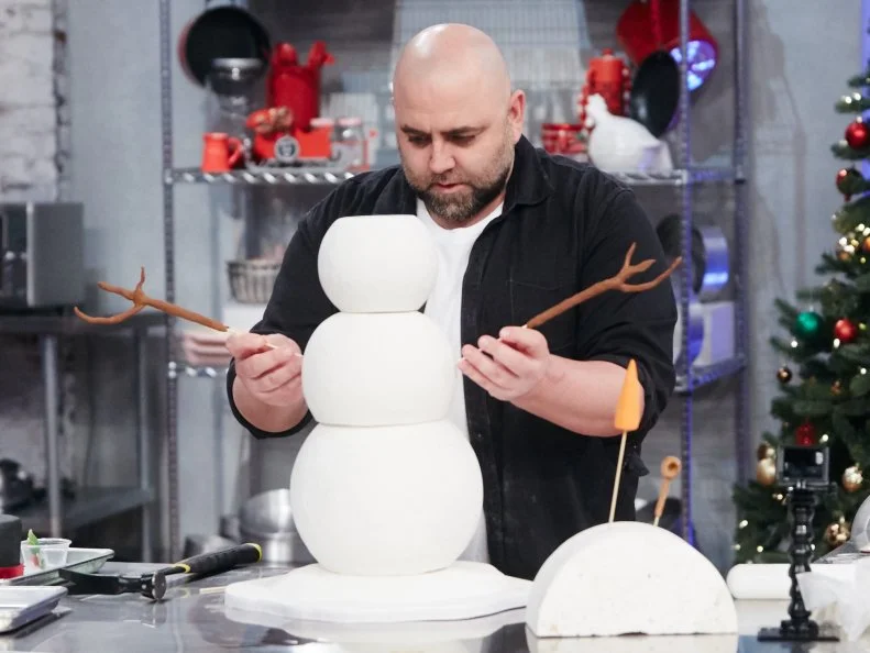 Host Duff Goldman preparing his dish, Snowman, as seen on Food Network's Holiday Baking Championship: Duff's Sweet Spot, Season 3.