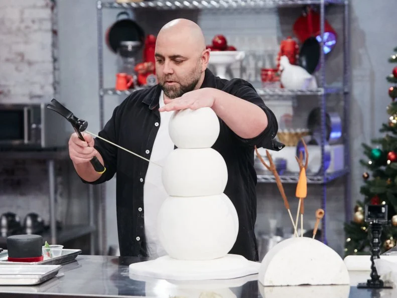 Host Duff Goldman preparing his dish, Snowman, as seen on Food Network's Holiday Baking Championship: Duff's Sweet Spot, Season 3.