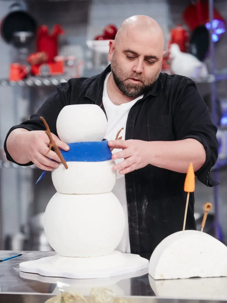 Host Duff Goldman preparing his dish, Snowman, as seen on Food Network's Holiday Baking Championship: Duff's Sweet Spot, Season 3.