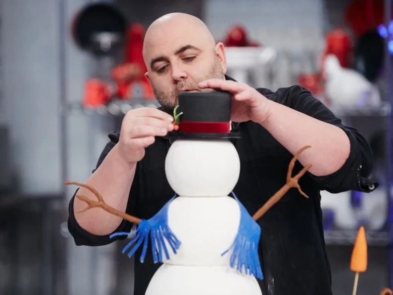 Host Duff Goldman preparing his dish, Snowman, as seen on Food Network's Holiday Baking Championship: Duff's Sweet Spot, Season 3.