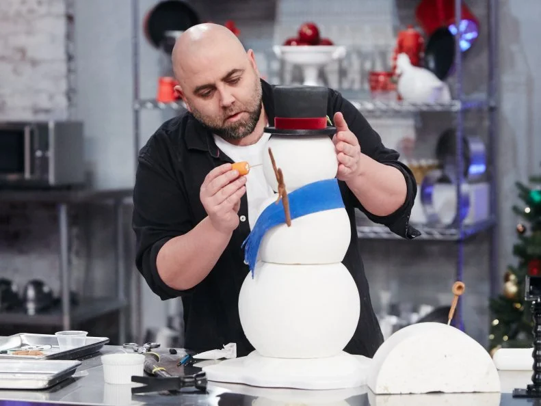 Host Duff Goldman preparing his dish, Snowman, as seen on Food Network's Holiday Baking Championship: Duff's Sweet Spot, Season 3.