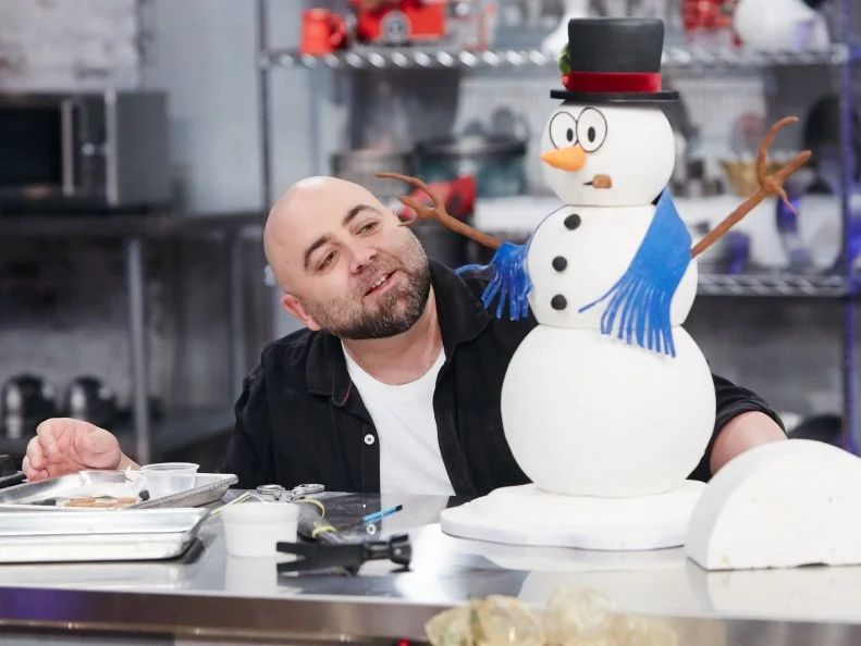 Host Duff Goldman preparing his dish, Snowman, as seen on Food Network's Holiday Baking Championship: Duff's Sweet Spot, Season 3.
