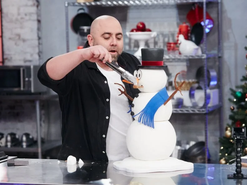 Host Duff Goldman preparing his dish, Snowman, as seen on Food Network's Holiday Baking Championship: Duff's Sweet Spot, Season 3.