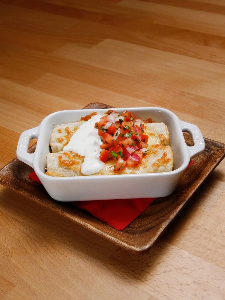 Mentor Anne Burrell's Chicken and Tomatillo Enchiladas dish is displayed, as seen on Food Network's Worst Cooks in America, Season 10.