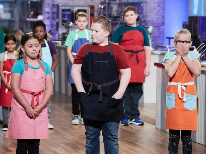 Contestants Brooke Cumberland, Jason Intravartolo and Charlotte D’Arabian during elimination, as seen on Food Network's Kids Baking Championship, Season 3.