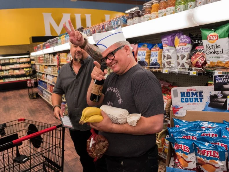 Host Guy Fieri and contestant Zane Caplanksy, as seen on Food Network's Guy's Grocery Games, Season 12.