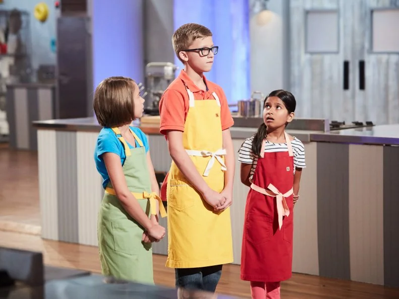 Contestants Audra Tow, Dylin Musgrove and Maya Jindal during elimination, as seen on Food Network's Kids Baking Championship, Season 3.