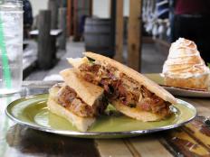 The Caribbean flavors that have influenced Louisiana cooking take center stage at this laid-back, open-air restaurant. A must-try is the Brisket Melt: The beef is rubbed with a chipotle pepper-studded marinade, smoked for 16 hours, then piled on a toasted roll. Ancho chile chutney, fried shallots and melted Jack cheese round out the sandwich.